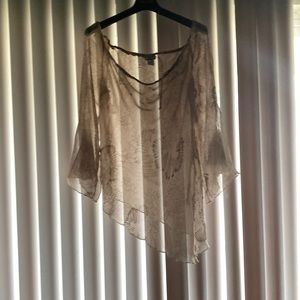 The Brand is A “Unique” and it is a Shirt Size 1X.Color Is Tan.